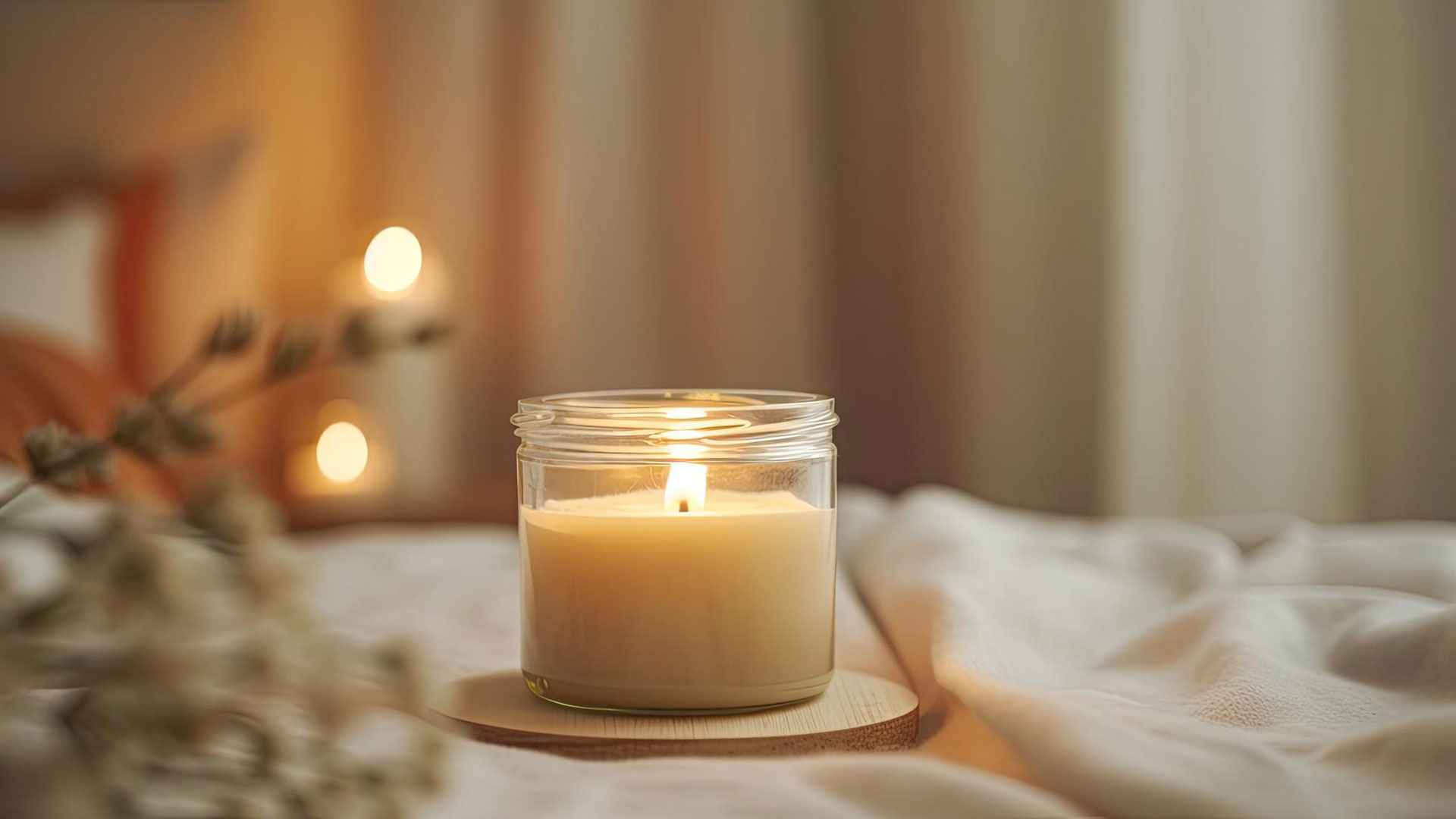candle burning in a glass jar