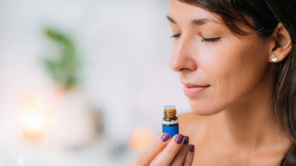lady smelling lavender oil