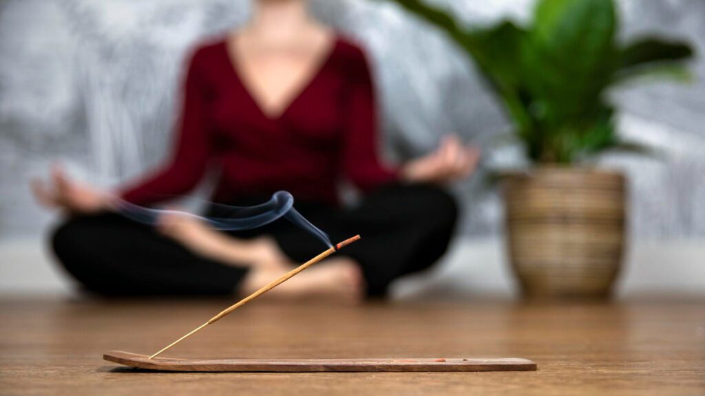 woman doing yoga To Burn Incense : to stay focused