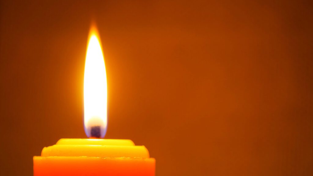 bright candle burning in room