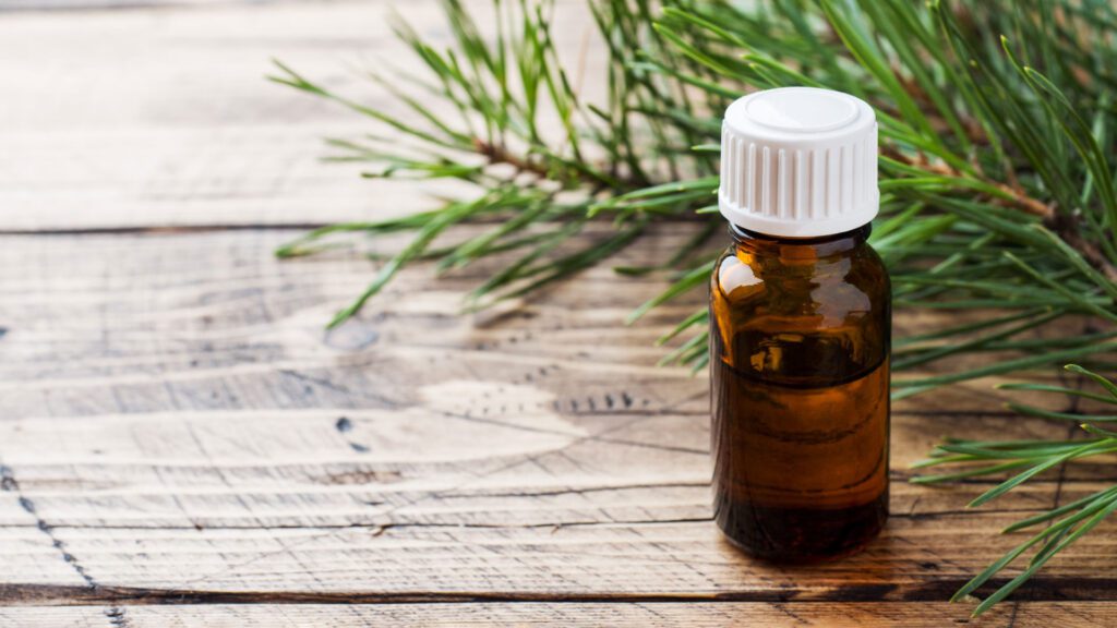 essential oil bottle placed on a table