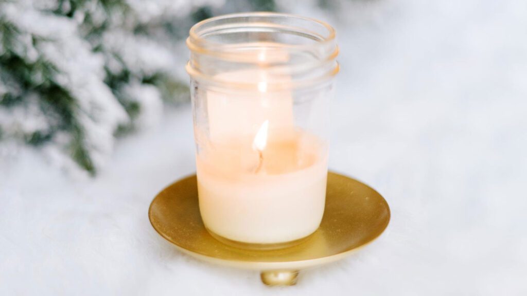 burning candle in a jar