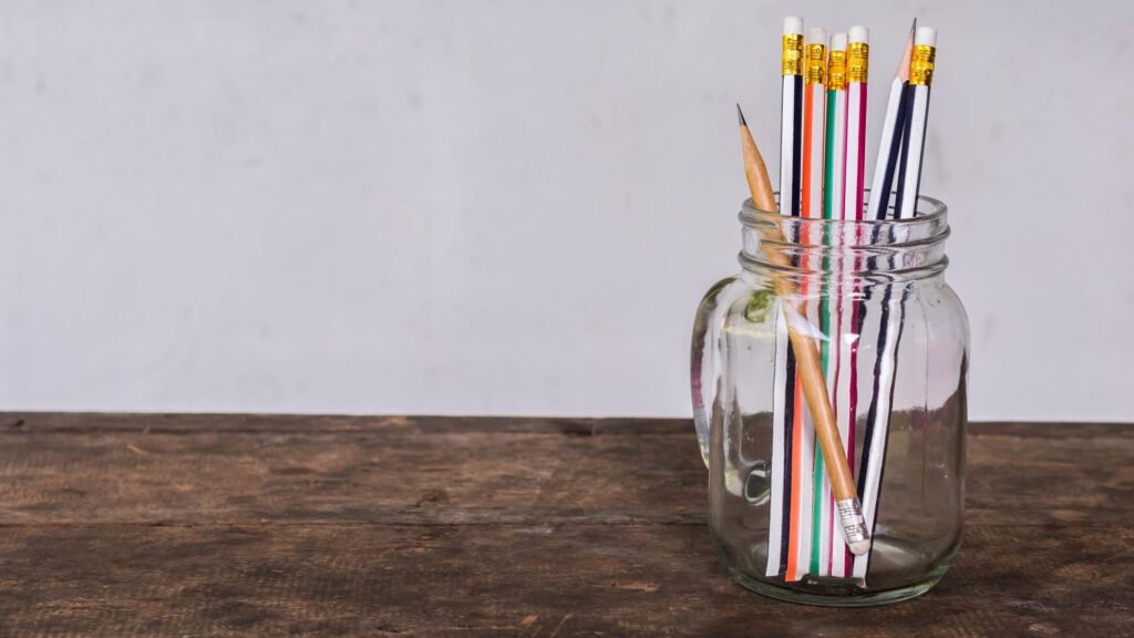 recycle candle jar used as pen organizer